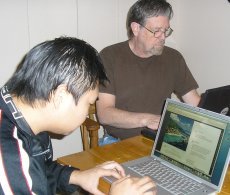 A photo of Robert Case and Jimmy Kung at work.